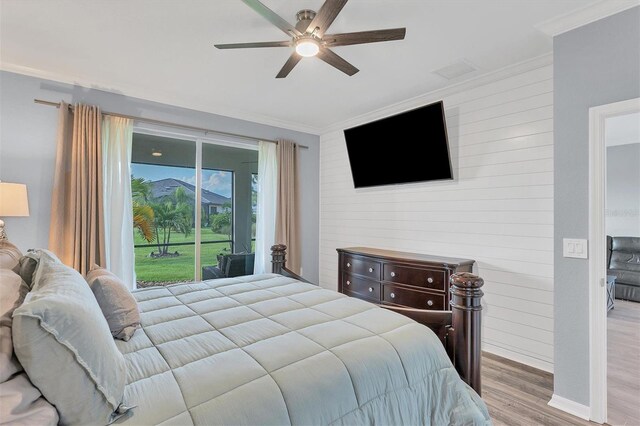 bedroom with ceiling fan, crown molding, access to outside, and light wood-type flooring