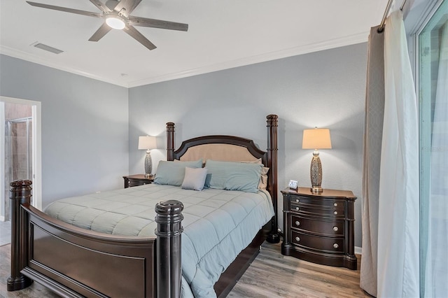 bedroom featuring ceiling fan, light wood-type flooring, and ornamental molding