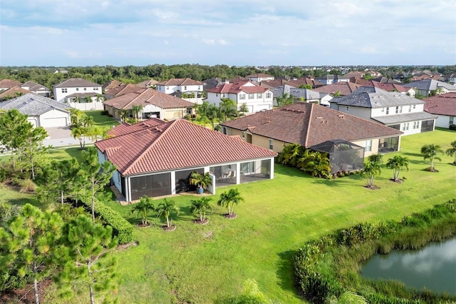 drone / aerial view featuring a water view