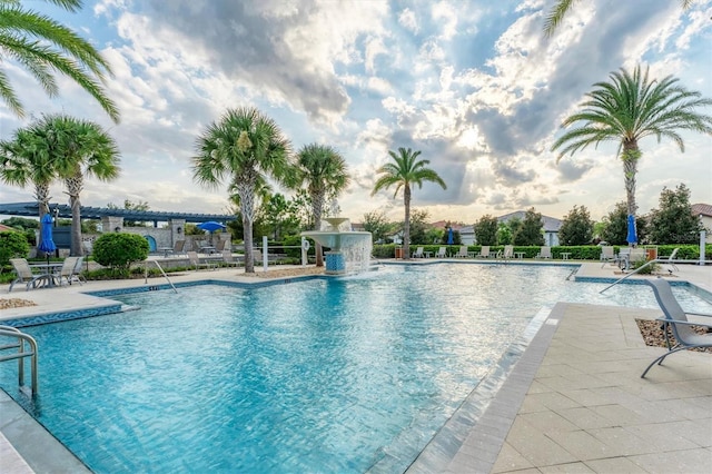 view of pool featuring pool water feature and a patio area