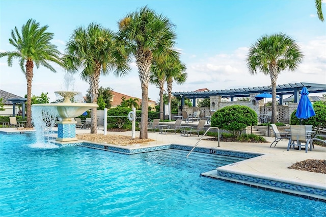 view of swimming pool featuring a patio area, a pergola, and pool water feature