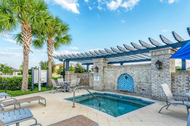 view of pool featuring a pergola and a patio area