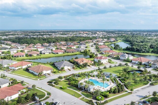 birds eye view of property with a water view