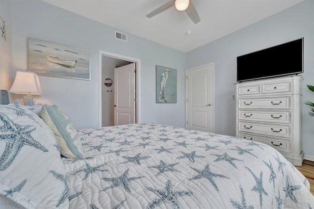 bedroom featuring hardwood / wood-style floors and ceiling fan