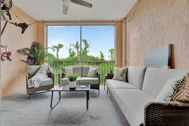 sunroom / solarium with ceiling fan and a wealth of natural light