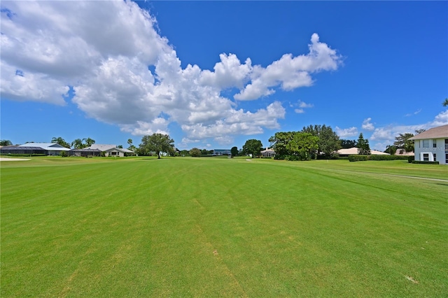 view of home's community with a lawn