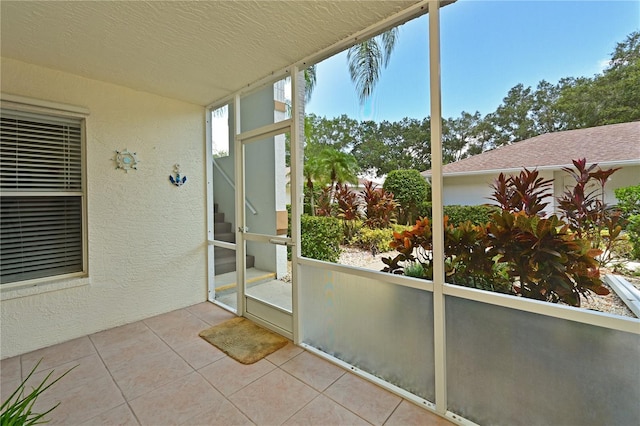 unfurnished sunroom featuring a wealth of natural light