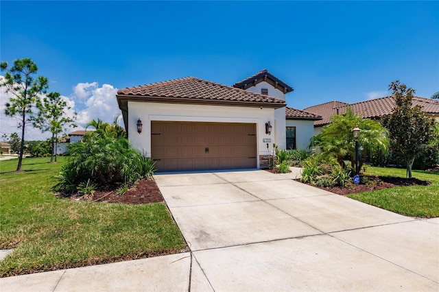 mediterranean / spanish house with a front yard and a garage