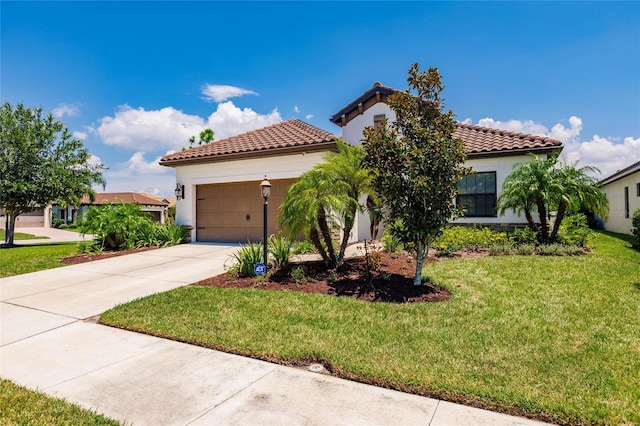 mediterranean / spanish-style home with a front yard and a garage