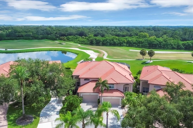 bird's eye view featuring view of golf course and a forest view