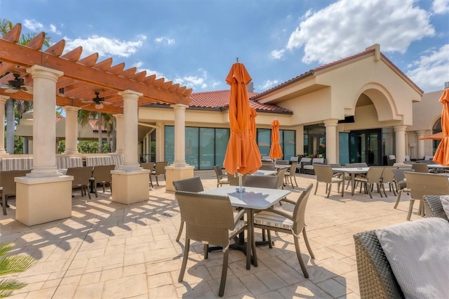 view of patio / terrace featuring ceiling fan and a pergola