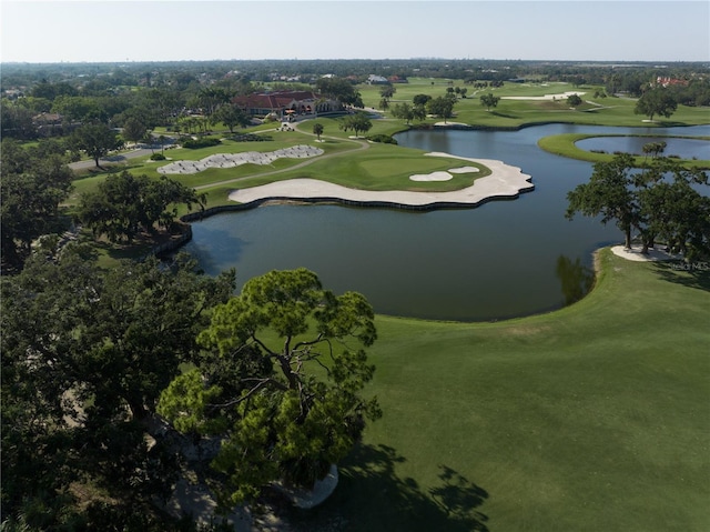 aerial view featuring view of golf course and a water view