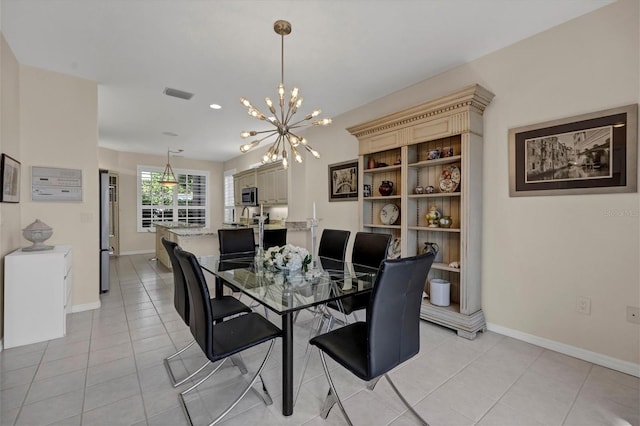 tiled dining area with an inviting chandelier