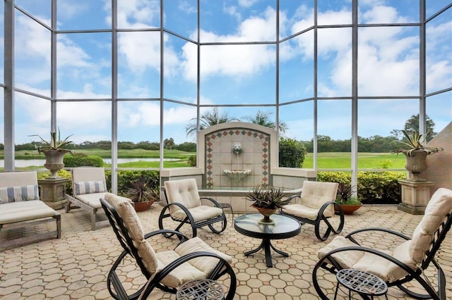 view of patio featuring glass enclosure