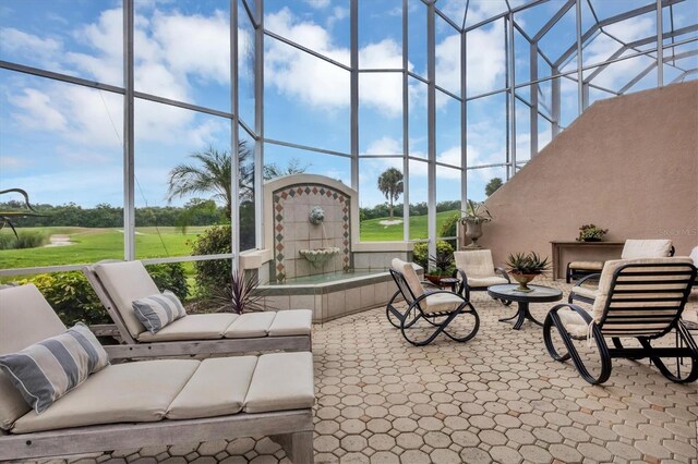 view of patio featuring glass enclosure