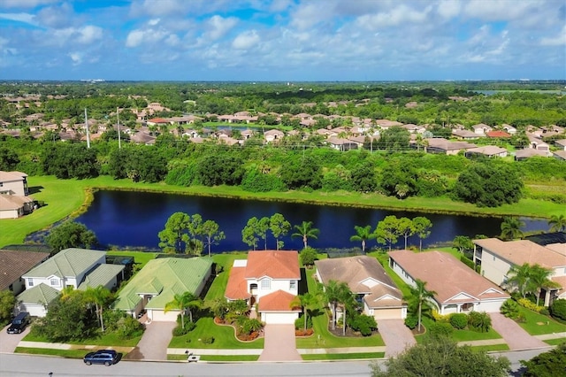 birds eye view of property with a residential view and a water view