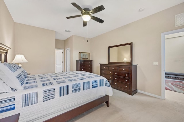 carpeted bedroom with ceiling fan, visible vents, and baseboards