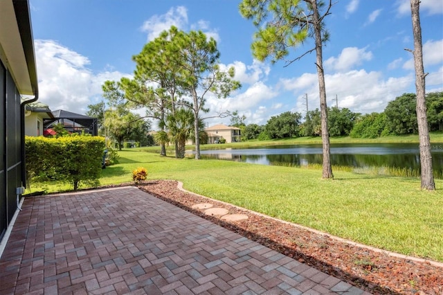 view of patio with a water view