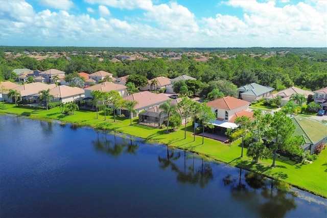 bird's eye view featuring a water view and a residential view