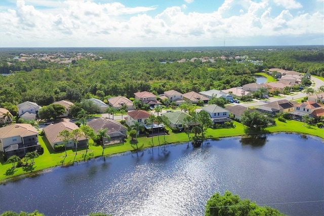 drone / aerial view featuring a water view and a residential view