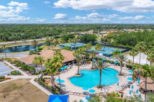 bird's eye view with a water view and a forest view