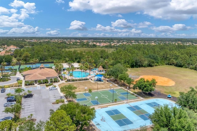 birds eye view of property with a wooded view