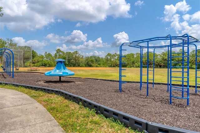 community playground featuring a lawn