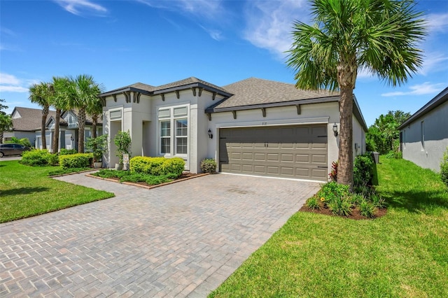 view of front of house with a front lawn and a garage