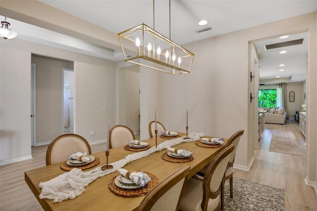 dining area with light hardwood / wood-style flooring