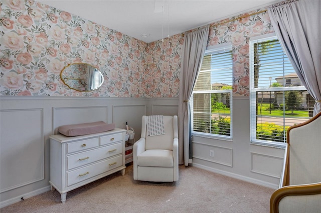 sitting room featuring light colored carpet