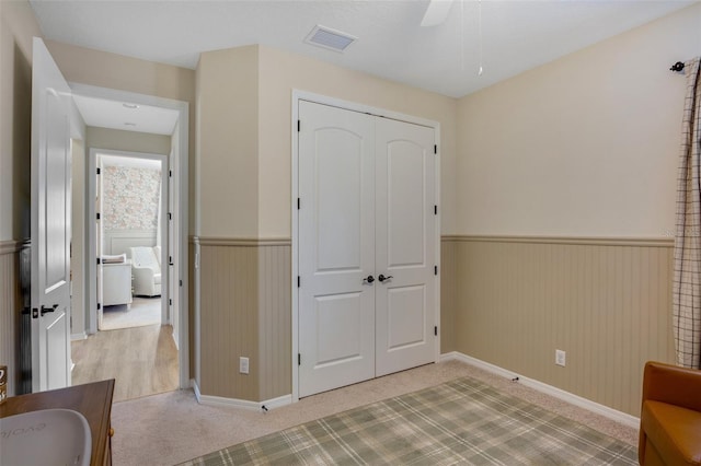 interior space with a closet and ceiling fan