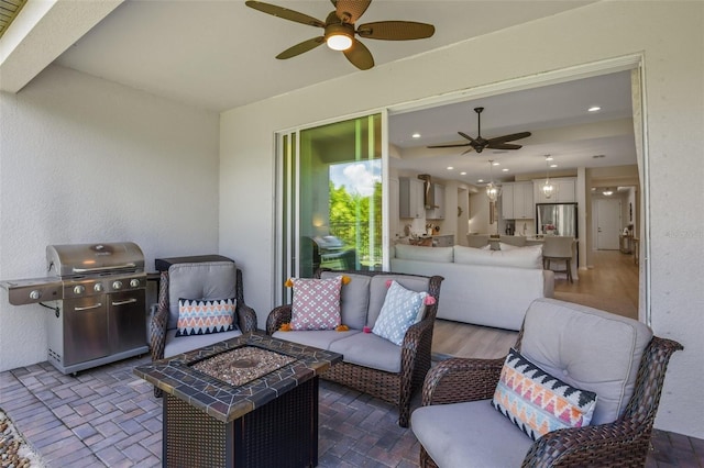 view of patio with area for grilling and an outdoor living space