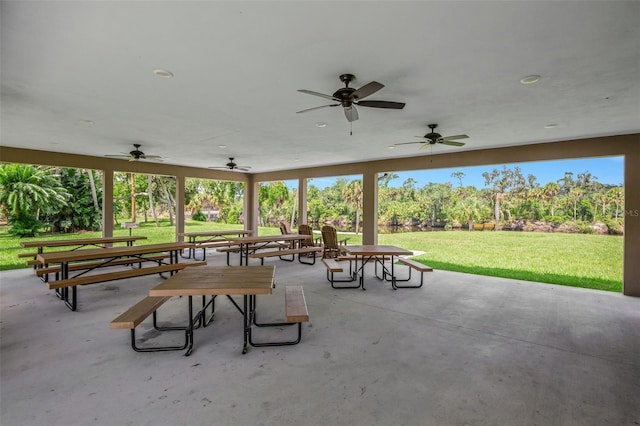 view of property's community featuring a yard and a patio area