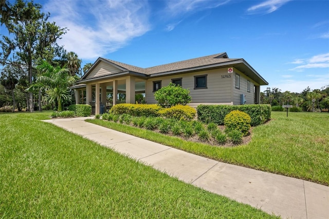 ranch-style house featuring a front lawn