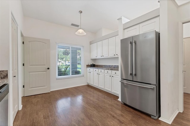 kitchen with white cabinets, appliances with stainless steel finishes, dark hardwood / wood-style floors, and pendant lighting