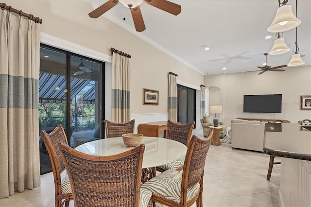 dining space featuring light tile patterned floors, ornamental molding, and ceiling fan