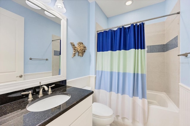 full bathroom with shower / bath combo, toilet, and vanity