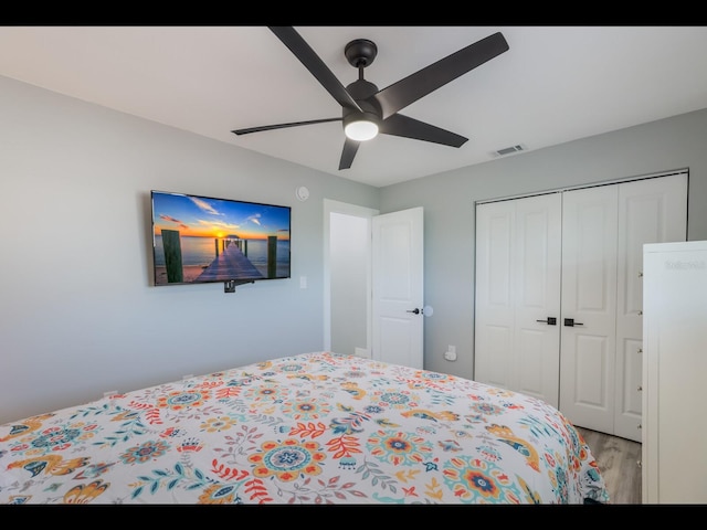 bedroom featuring a closet, ceiling fan, and light hardwood / wood-style floors