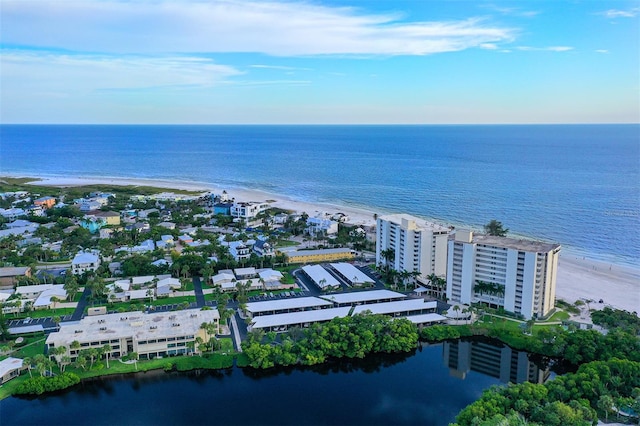 bird's eye view with a water view and a view of the beach