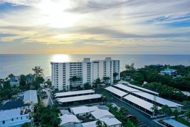 aerial view at dusk with a water view