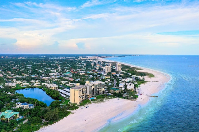 birds eye view of property featuring a view of the beach and a water view