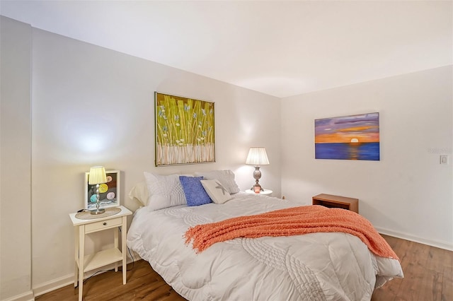 bedroom with hardwood / wood-style flooring