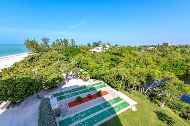 birds eye view of property with a beach view and a water view