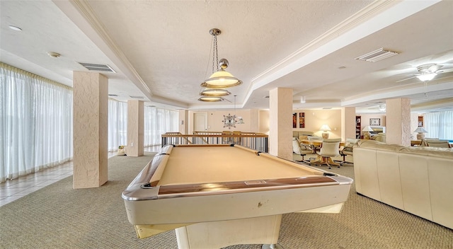 playroom with a tray ceiling, ornamental molding, bar area, and light colored carpet