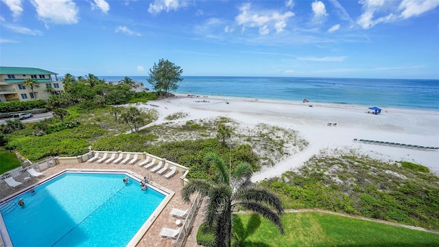 exterior space featuring a view of the beach and a water view