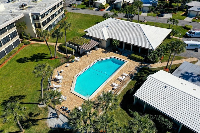 view of swimming pool with a yard and a patio