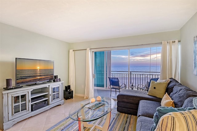 tiled living room with a water view