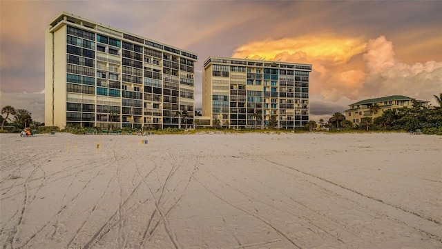 view of outdoor building at dusk