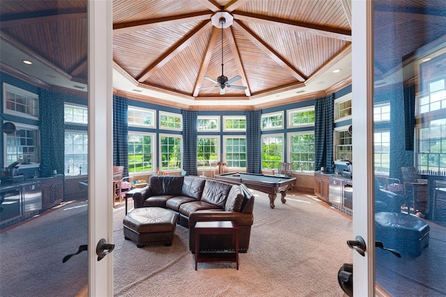 sunroom with ceiling fan, billiards, french doors, and a tray ceiling