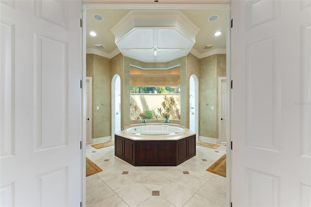 bathroom featuring ornamental molding, a bath, and tile patterned floors